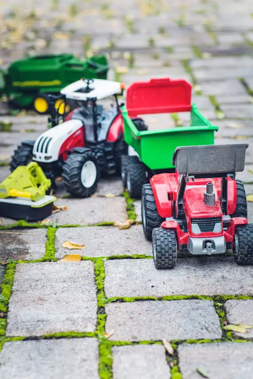 toy trucks on stone tiles